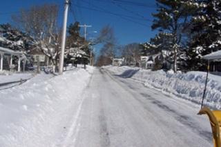 Plowed street with snowbanks