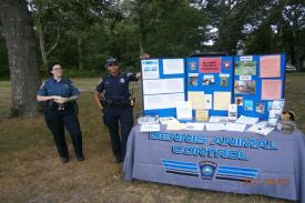 Two People Next to Large Booth