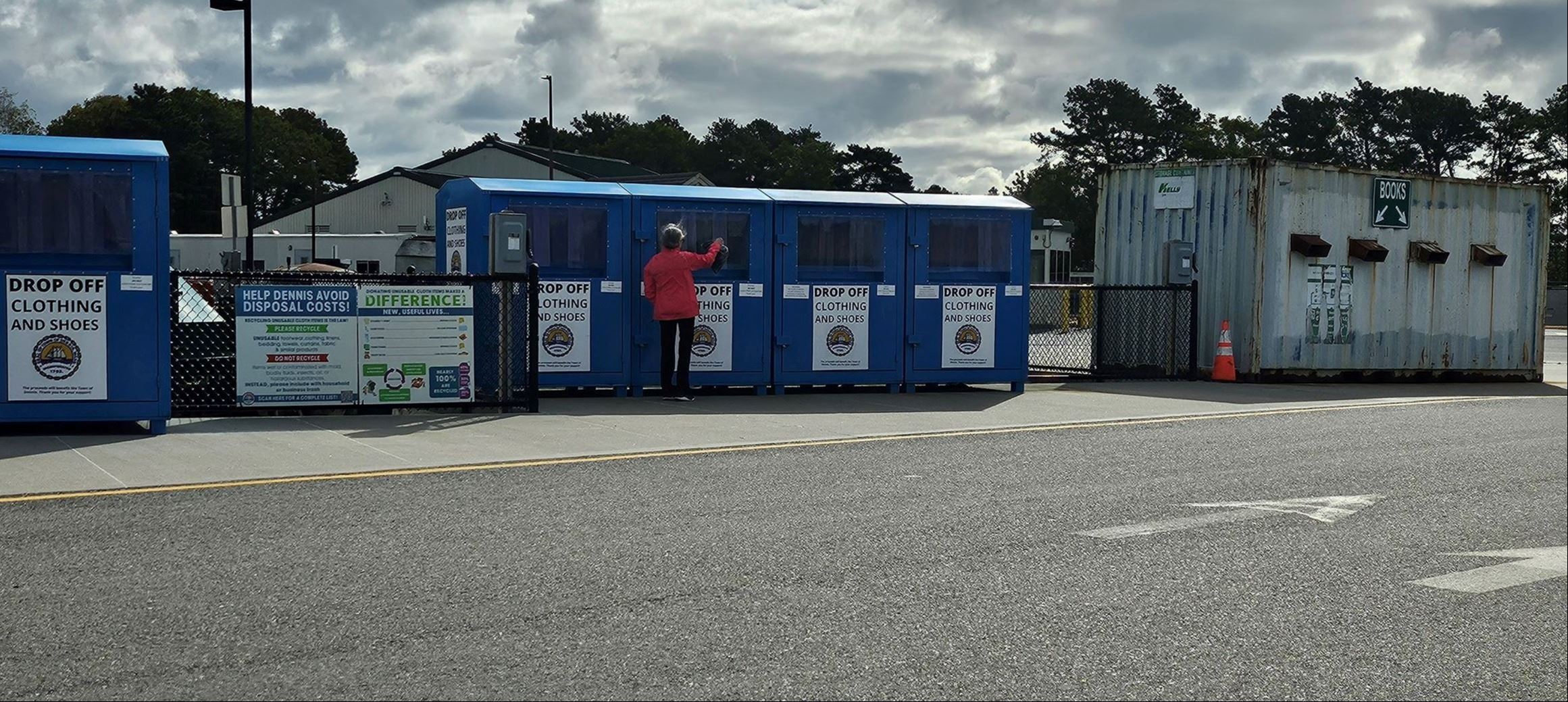 Photo of donation bins with new sign